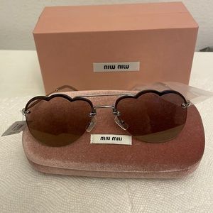 - Brand new Miu Miu sunglasses MU 56US58-X brown.